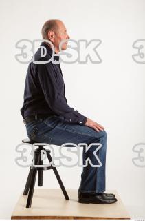 Sitting pose blue deep shirt jeans of Ed 0005